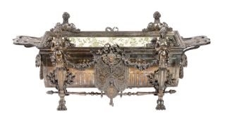 A silver plated table top jardiniere, circa 1890, rectangular with twin flap handles above relief
