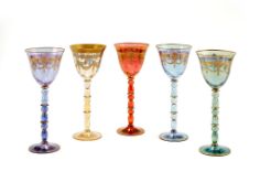 A harlequin set of four various modern Continental coloured glass and gilt goblets , possibly