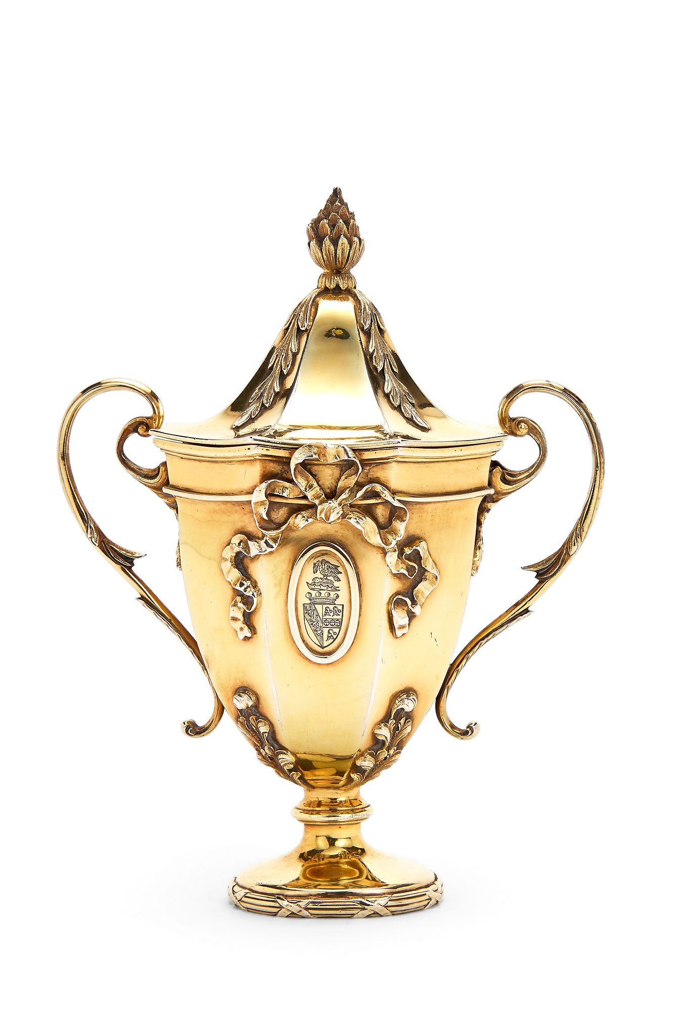 An Edwardian silver gilt cup and cover by George Fox, London 1903, with a pine cone finial to the