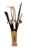 A quantity of assorted walking sticks, late 19th and 20th century, including a substantial Italian