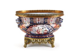 A large Continental porcelain gilt-metal mounted oval jardiniÃ¨re, painted in Imari manner style,