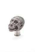 A silver coloured novelty bottle stopper or walking stick handle, unmarked, early 20th century,