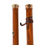 A late 18th century gold and malacca walking stick, the gold grip with engraved scrolled foliate