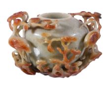 A Chinese jadeite carved celadon and russet vase, the exterior using the natural inclusions on the