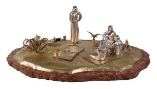 Asprey, a silver and parcel three colour gilt model of Arabs in the Desert, partial marks, resting