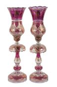 A pair of Bohemian/Czech purple-flashed, clear and gilt glass table lustres and storm shades, 67cm