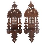 Ω A pair of Egyptian carved and stained hardwood wall brackets, with mashrabiya work panels and