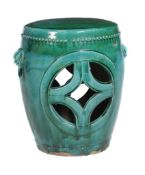 A large Chinese green and blue glazed pottery garden seat , late Qing Dynasty, with lion mask