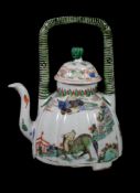 A Chinese Famille Verte wine pot and a cover , Kangxi, the fluted dome shaped body supported on