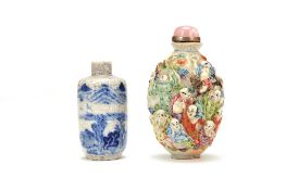 A Chinese Famille Rose snuff bottle, the exterior moulded with figures and painted in coloured