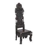 A carved hardwood high back chair , 20th century, South East Asian, the back carved with elephants,