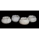 A set of four Indian carved marble jadinieres in the form of stylised lotus flowers, 20th century,