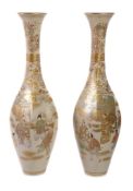 A large pair of Japanese Satsuma vases, Meiji Period, painted with figures to the four sides, 64.