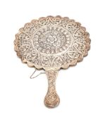 An Ottoman Turkish silver mirror, Tugrah mark, apparently no sah mark, scalloped circular and