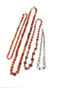 Three strands of faceted Islamic carnelian bead necklaces, circa 12th century A.D. and later; and a