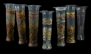 Seven various Islamic painted glass vessels, the green glass painted and gilt with a wide band of