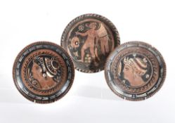Three Apulian red-figure dishes, Greek South Italy, circa 4th century BC, each on a raised ring
