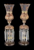 A pair of Czech or Beykoz clear glass and gilt table lustres with storm shades, for the Near