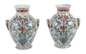 A pair of Iznik style vases, probably Cantagalli, 19th or early 20th century, brightly painted with