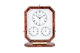 Asprey, a gilt metal and brown lacquer triple time zone alarm desk clock, three quartz movements,