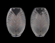 Lalique, Cristal Lalique, a pair of moulded clear and frosted glass ovoid vases, with red dot