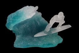 Daum, a pate de verre model of a surfer taking a wave, engraved signature, 28cm long