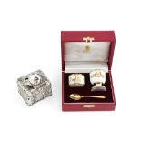 Asprey, an enamel and silver gilt christening set, comprising: a napkin ring, an egg cup and silver