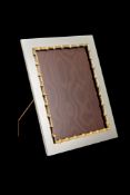 Gucci, an electro-plated photo frame, with a gilt bamboo border and a wood easel back, 31cm (12 1/