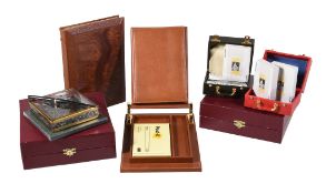 Asprey, a brown leather desk set, the hinged cover holding a brown leather address book, with a