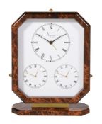 Asprey, a gilt metal and brown lacquer triple time zone alarm desk clock, three quartz movements,