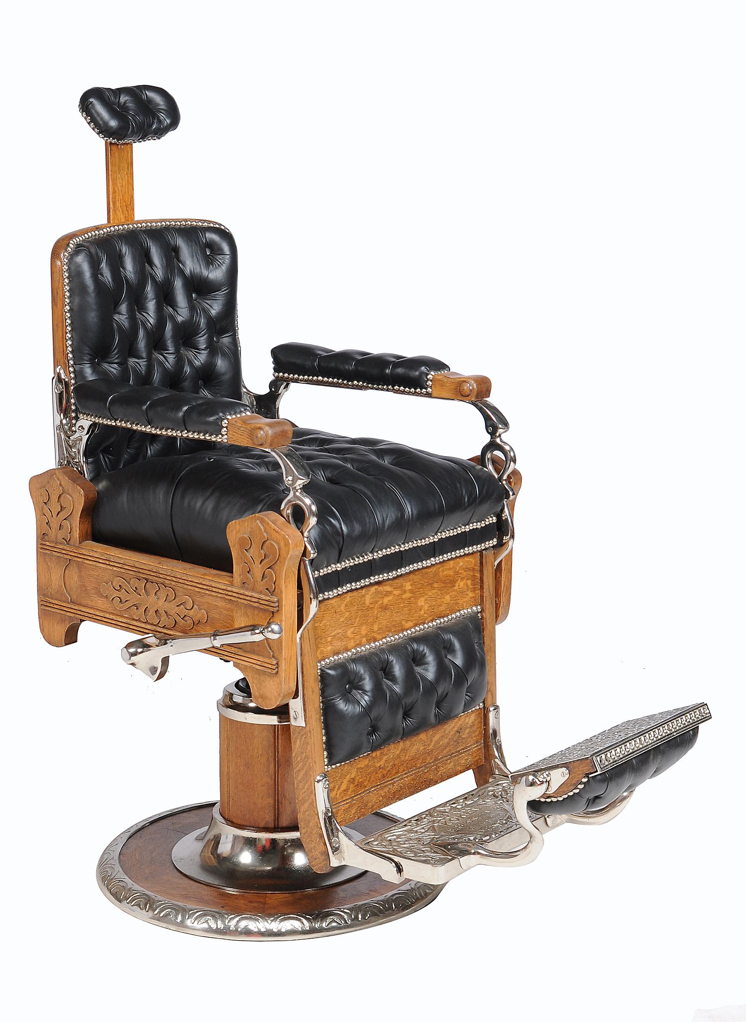 An oak, chromed metal and leather upholstered barber's chair, Koken, early 20th century and later