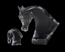 Baccarat, Tauni de Lesseps, a clear glass model of a horse head, 17cm high; and a larger modern