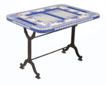 A ceramic and glass inset games table, with inset backgammon board, 20th century, the rectangular