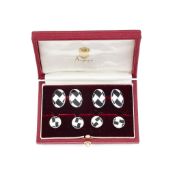 A pair of silver and enamel cufflinks and four dress studs, retailed by Asprey, the double sided