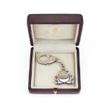 Asprey, a silver frog key ring, London 1997, the frog suspended below a curb link chain, to the