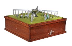 Escalado, a mechanical horse racing game, in an oak table top case with a lift-off cover, on four