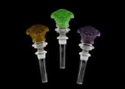 Rosenthal for Versace, three glass Medusa head bottle stoppers, in medium green, lime green and