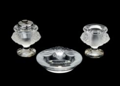 Lalique, Cristal Lalique, Tete De Lion, a clear and frosted glass smoker's set, of a table lighter