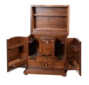 Dunhill, a hardwood humidor, the lift up cover and two doors opening to two drawers and eighteen