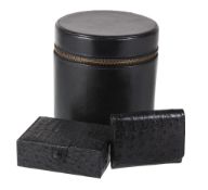 Asprey, a black ostrich stud box, the rectangular case with a button fastening, the interior with