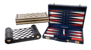 Ω Asprey, a blue leather attache case, with two key lock clasps, opening to a backgammon board, a