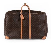 Louis Vuitton, Monogram, a large soft coated fabric suitcase, with leather handles, bands, piping