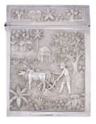 An Indian silver rectangular card case, Calcutta, late 19th century, chased with rural scenes, of a