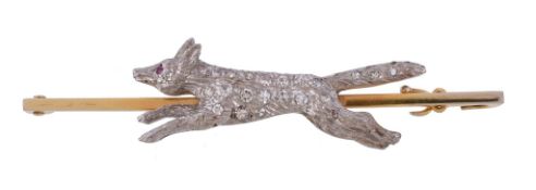 A 1920s diamond fox brooch, the running fox set with eight cut diamonds, estimated to weigh 0.27