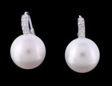 A pair of South Sea cultured pearl and diamond earrings, the South Sea cultured pearls below a