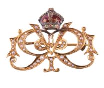 An enamel and seed pearl George V coronation brooch, circa 1910, the cypher set with seed pearls