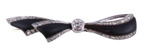 An Art Deco onyx and diamond bow brooch, circa 1920, the central old brilliant cut diamond,