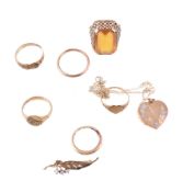 A gold coloured buckle ring, finger size R 1/2; further rings; and other items, 27.8g gross
