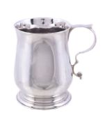 An early George III silver small baluster mug by Walter Brind , London 1766, with a tongue-capped