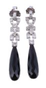 A pair of onyx and diamond ear pendants, the facetted onyx drops suspended below an articulated